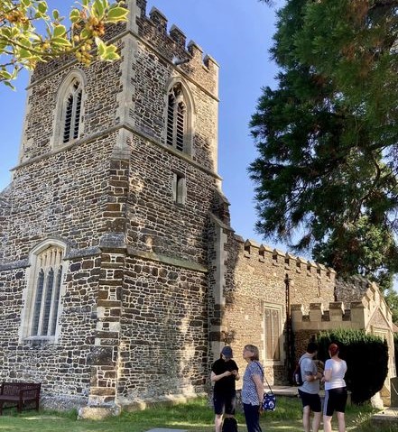 people look at a church tower